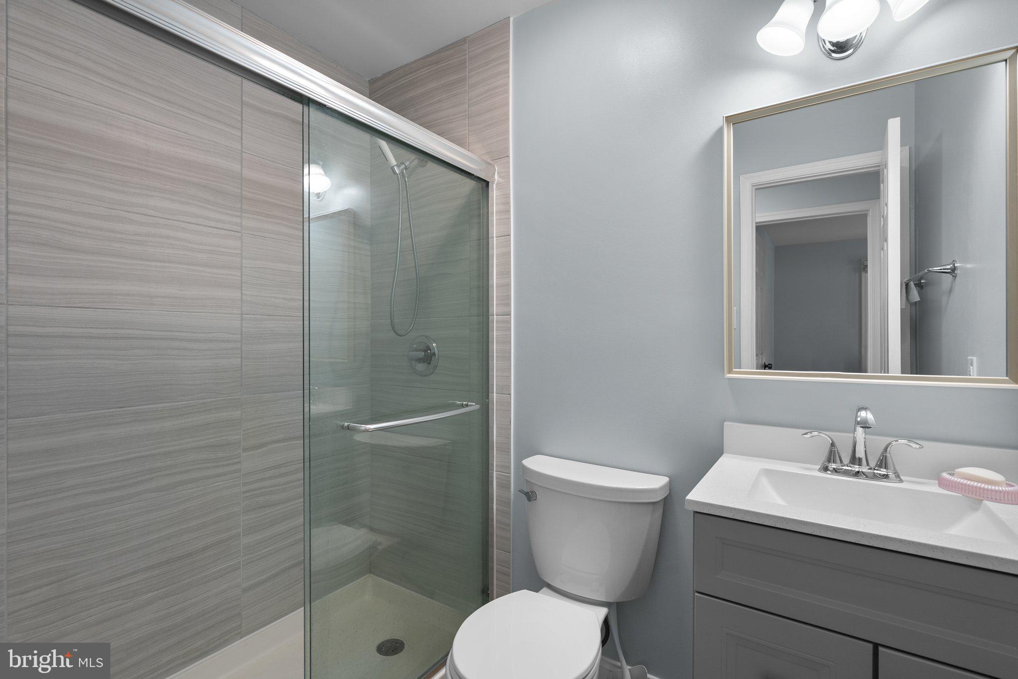 11631 Ranch Lane North Potomac, MD 20878 - Photo 25 of 32 a bathroom with a sink toilet and shower