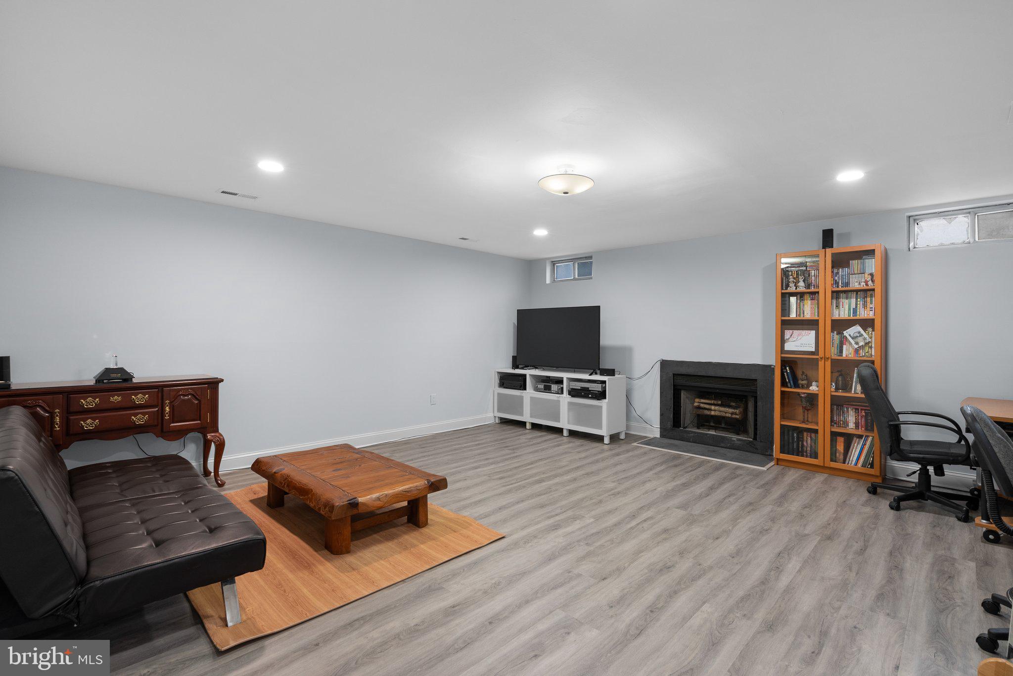 11631 Ranch Lane North Potomac, MD 20878 - Photo 26 of 32 a living room with furniture and a flat screen tv