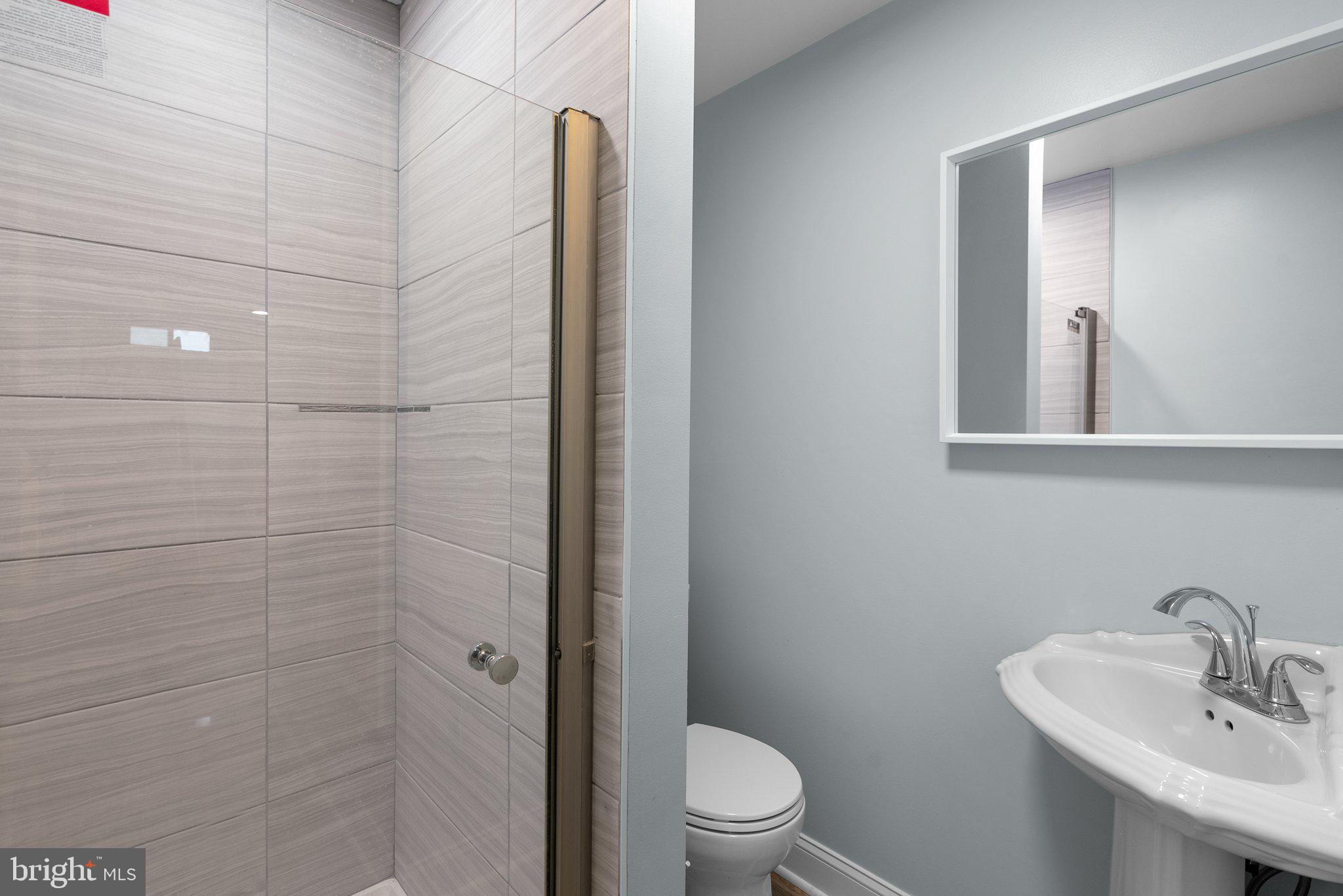 11631 Ranch Lane North Potomac, MD 20878 - Photo 28 of 32 a bathroom with a toilet a sink and shower