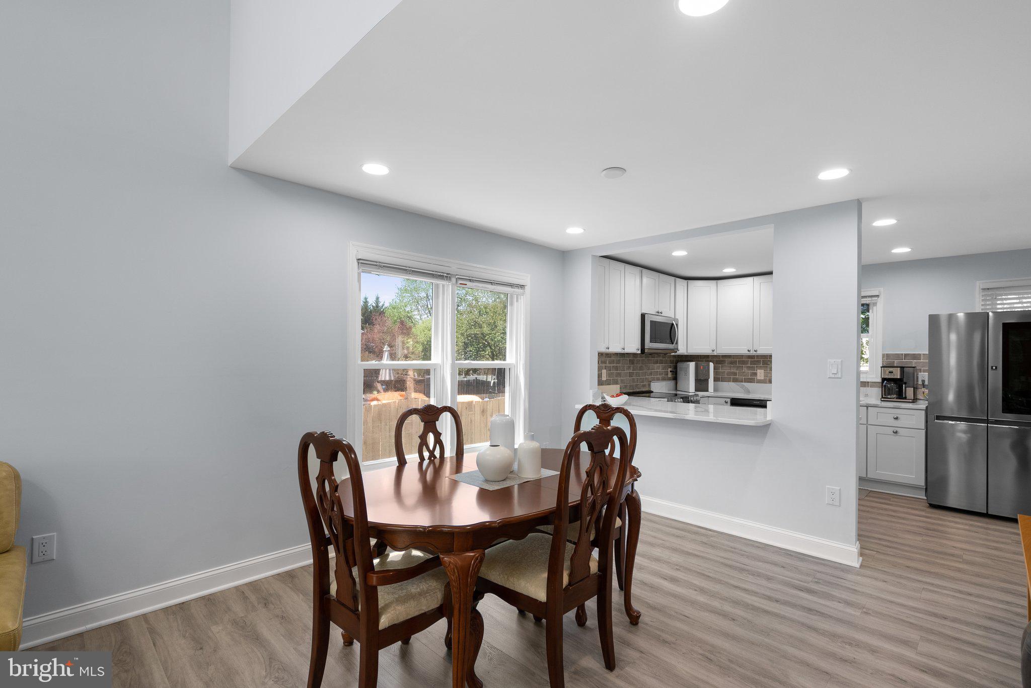 11631 Ranch Lane North Potomac, MD 20878 - Photo 9 of 32 a view of a dining room with furniture and wooden floor