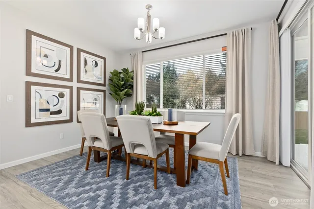 a view of a dining room with furniture window and outside view