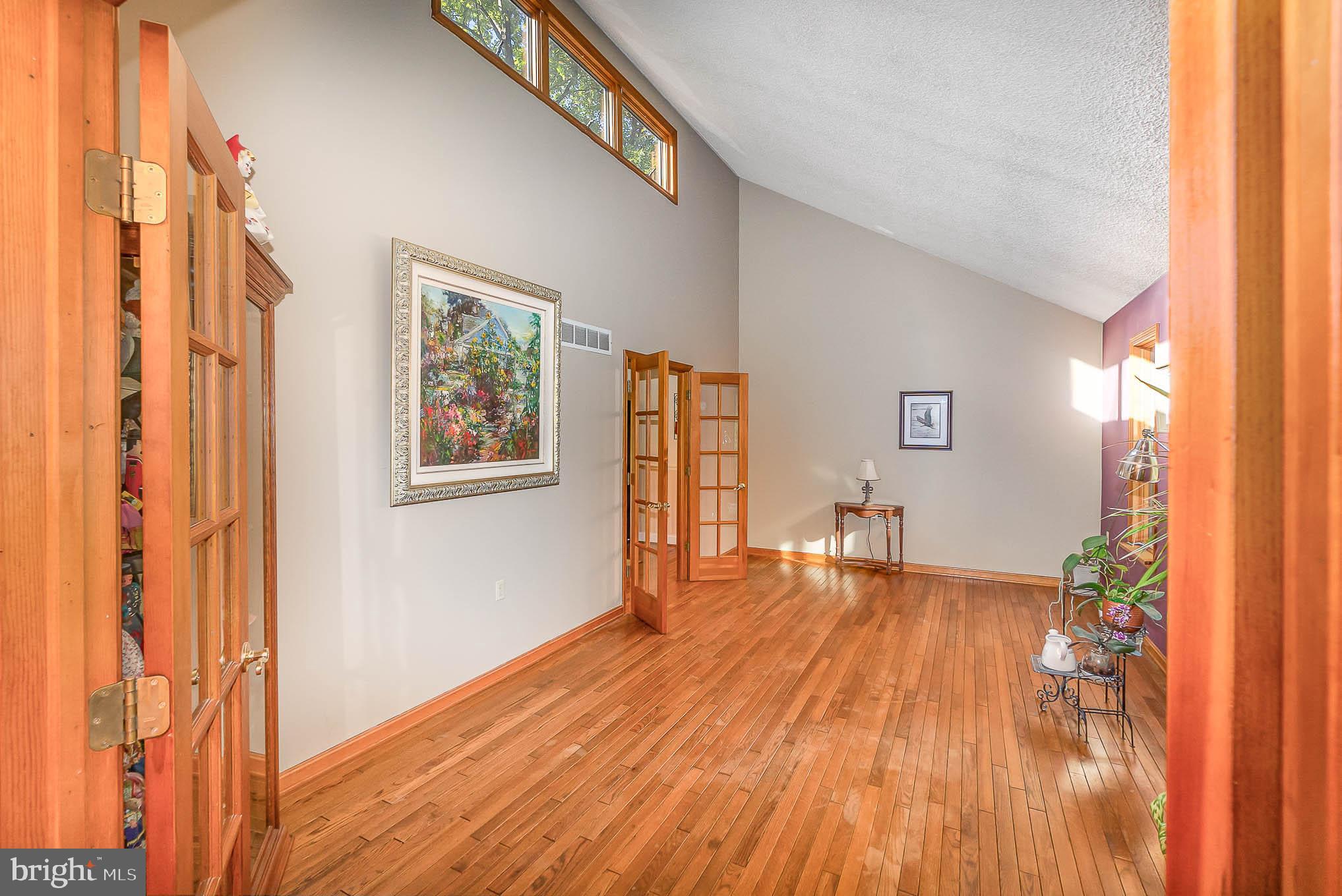 1062 Dr Jack Road Conowingo, MD 21918 - Photo 7 of 51 Living Room w/ hardwoods and transom windows above