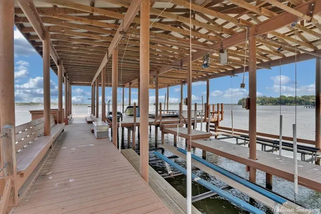 a wooden floor with a lake view