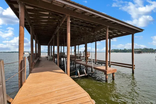 a view of a lake with sitting area