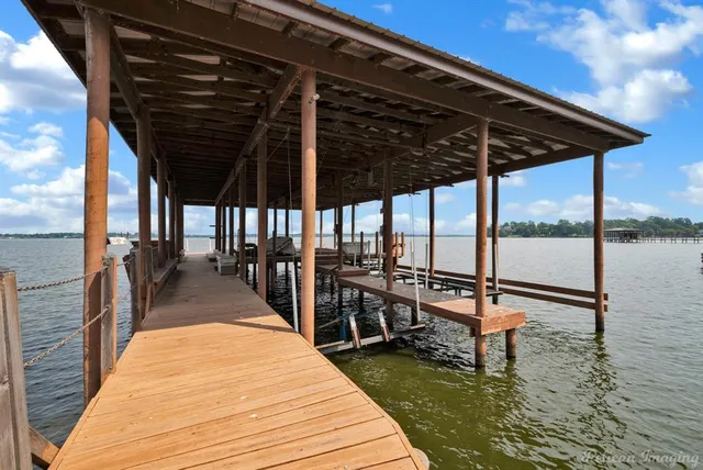 a view of a lake with sitting area