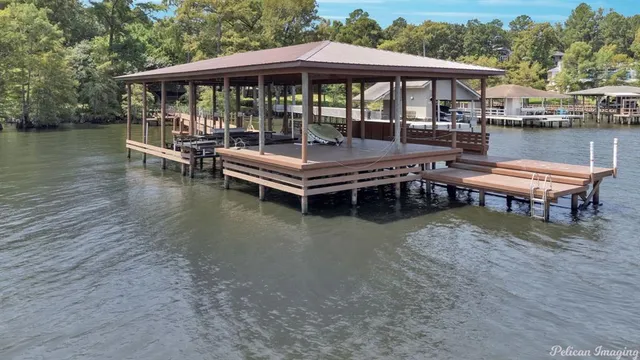 a roof deck with a table and chairs