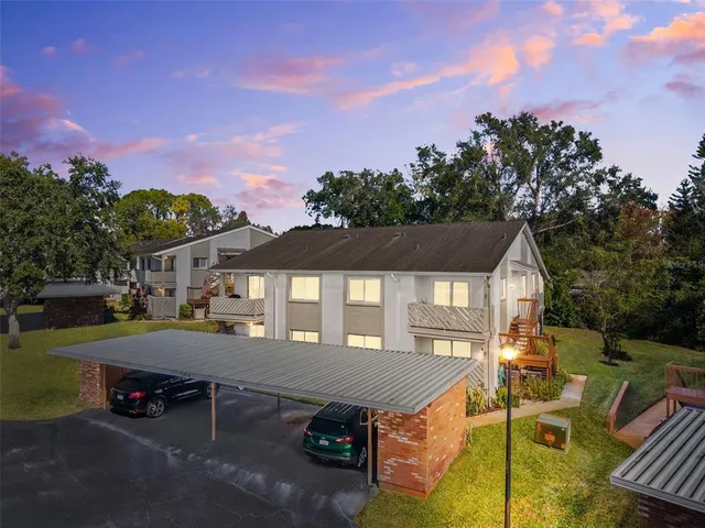 a front view of a house with a yard table and chairs