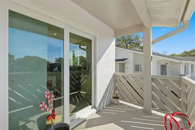 a view of balcony with wooden floor and outer view