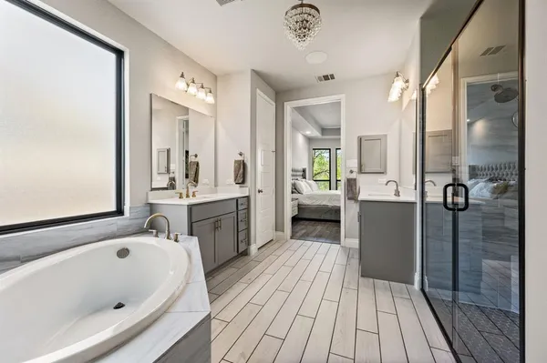 a bathroom with a bathtub and a sink