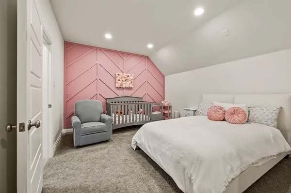 a bedroom with two beds and painted walls