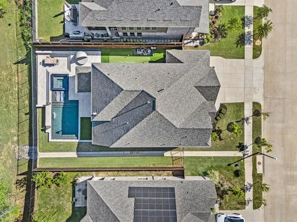 aerial view of a house with a swimming pool