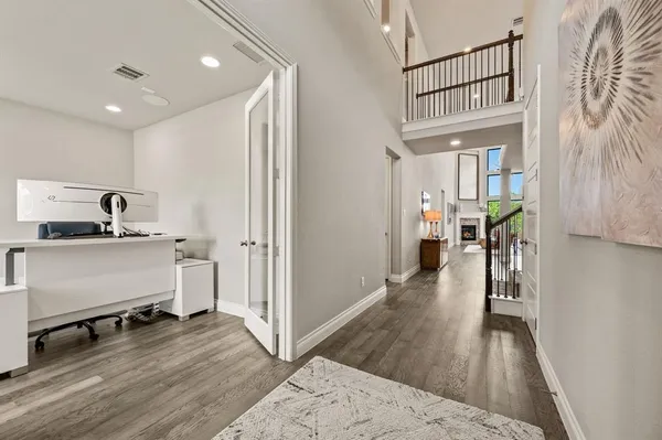 a view of a hallway view with wooden floor and furniture