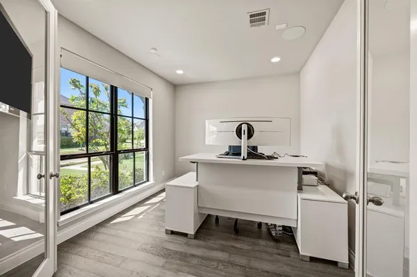 a room with a window and wooden floor