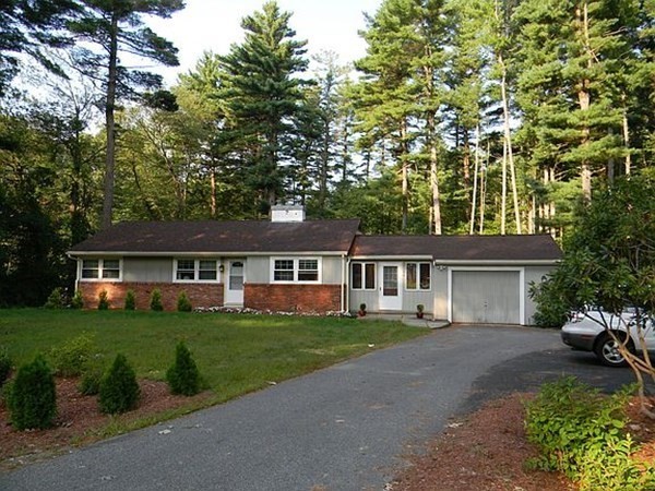 front view of a house with a garden