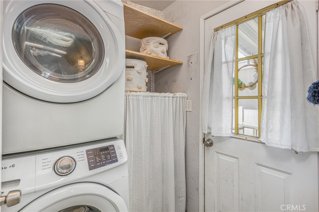 8681 Katella Avenue, Unit 897 Stanton, CA 90680 - Photo 13 of 31 a utility room with dryer and washer