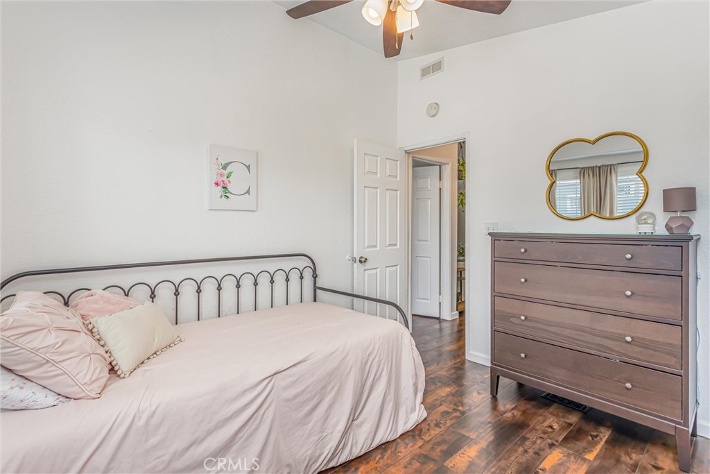 8681 Katella Avenue, Unit 897 Stanton, CA 90680 - Photo 16 of 31 a bedroom with a bed and a dresser