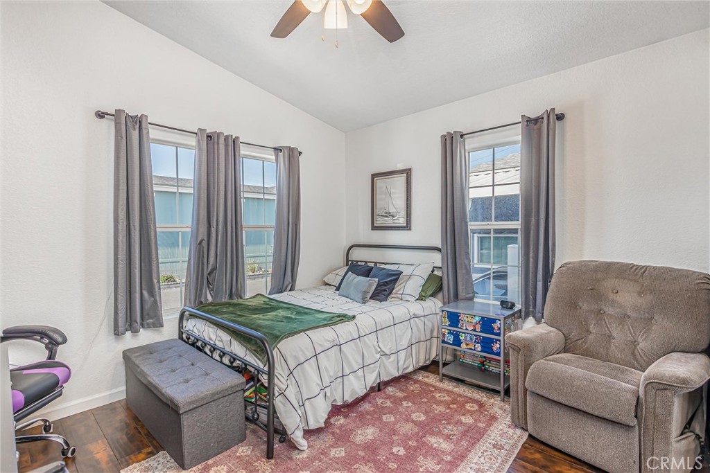 8681 Katella Avenue, Unit 897 Stanton, CA 90680 - Photo 17 of 31 a bedroom with bed couch and window