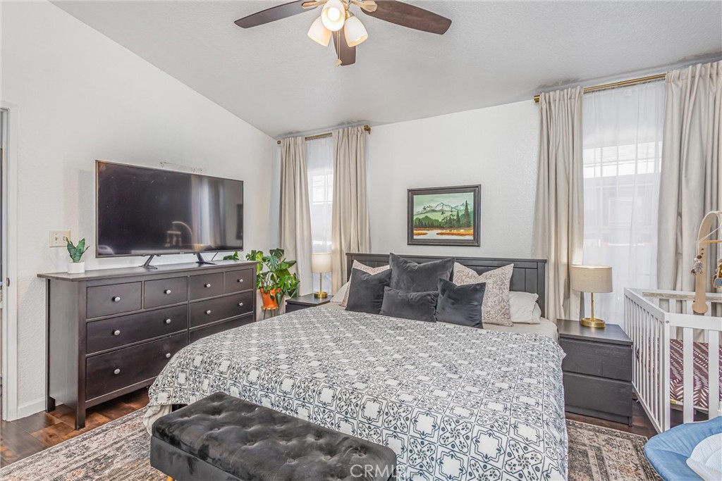 8681 Katella Avenue, Unit 897 Stanton, CA 90680 - Photo 19 of 31 a bed room with a bed a television and a large window