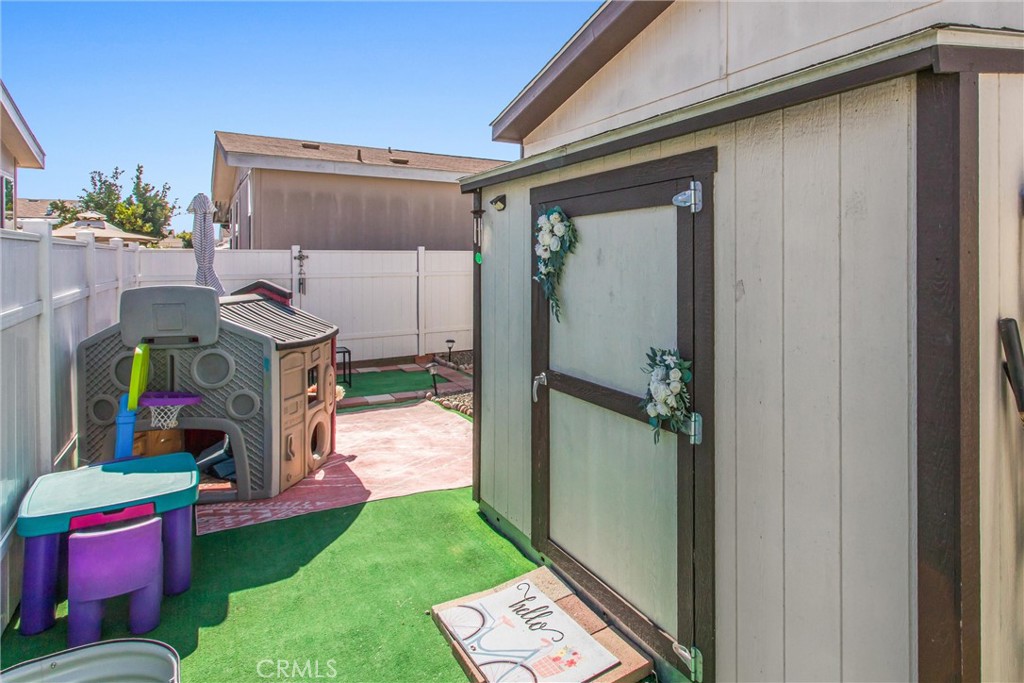 8681 Katella Avenue, Unit 897 Stanton, CA 90680 - Photo 26 of 31 a yellow house with outdoor space