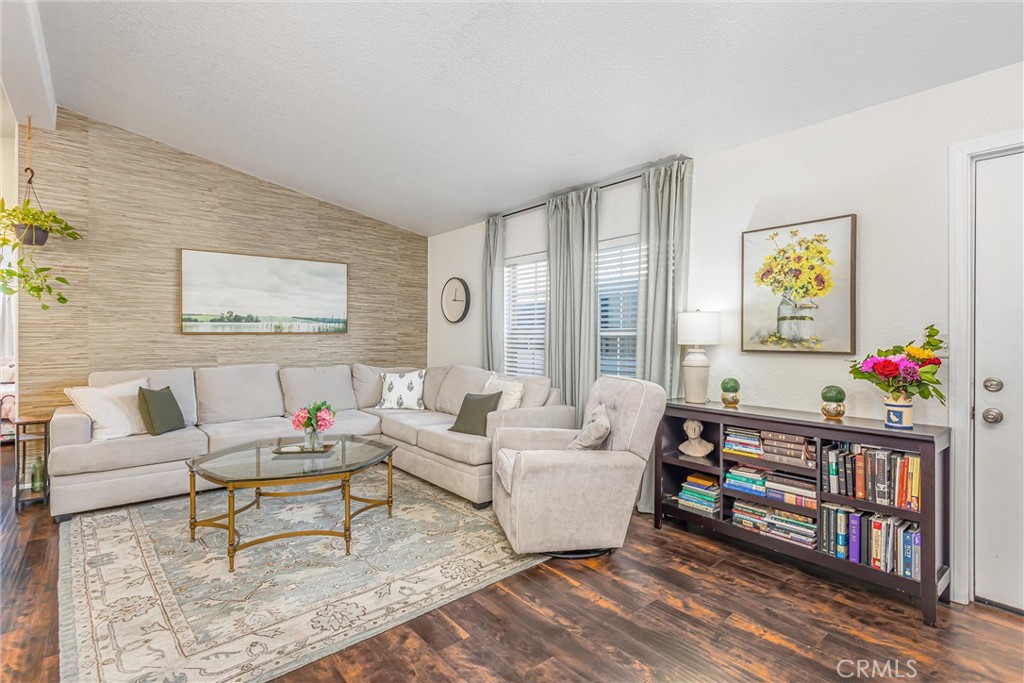 8681 Katella Avenue, Unit 897 Stanton, CA 90680 - Photo 5 of 31 a living room with furniture and a floor to ceiling window