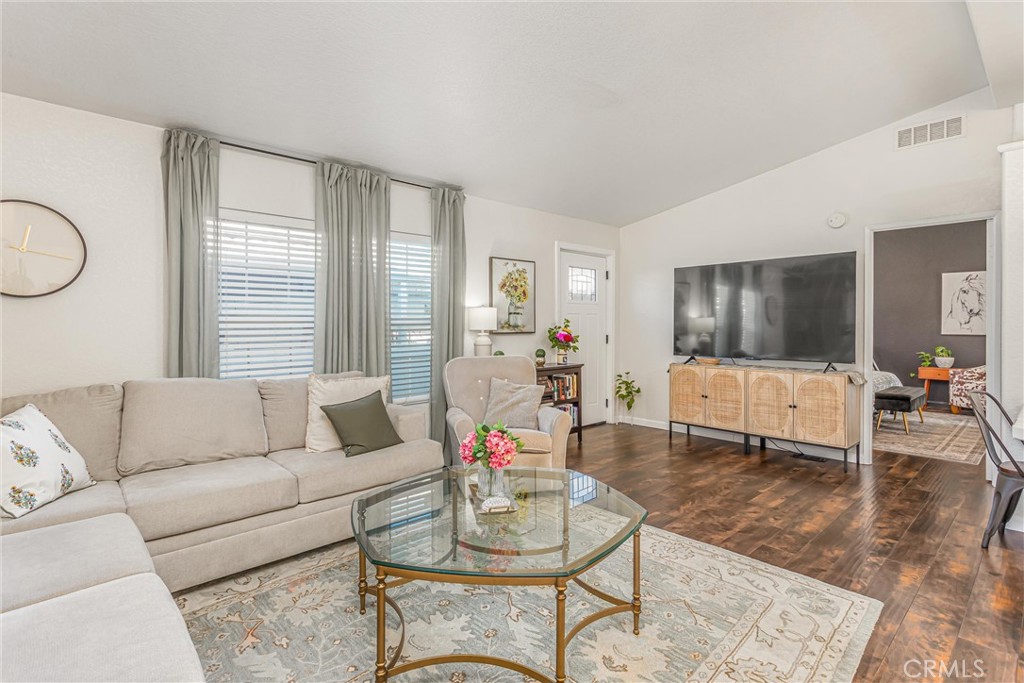 8681 Katella Avenue, Unit 897 Stanton, CA 90680 - Photo 6 of 31 a living room with furniture and a flat screen tv