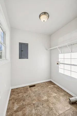 a view of a livingroom with a dishwasher and a window