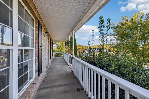 a view of a porch with wooden stairs and stairs