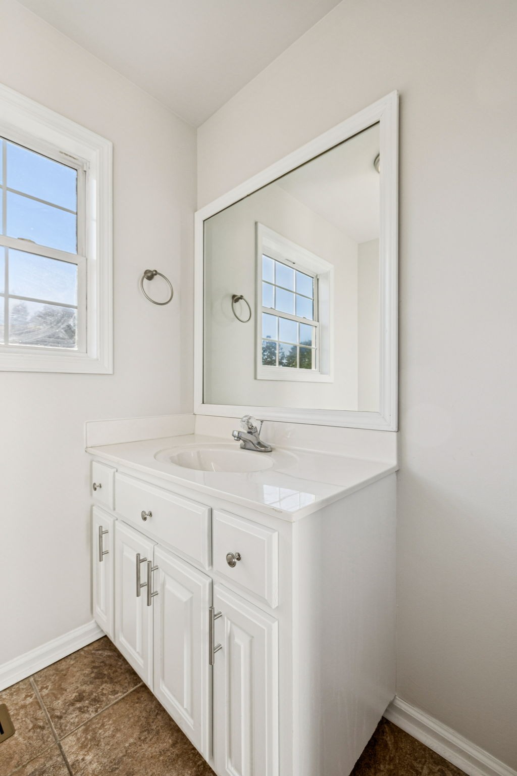 2995 Pipkin Hills Drive Spring Hill, TN 37174 - Photo 21 of 43 a bathroom with a sink a vanity and a mirror