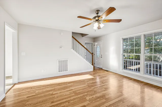 a view of an entryway with wooden floor