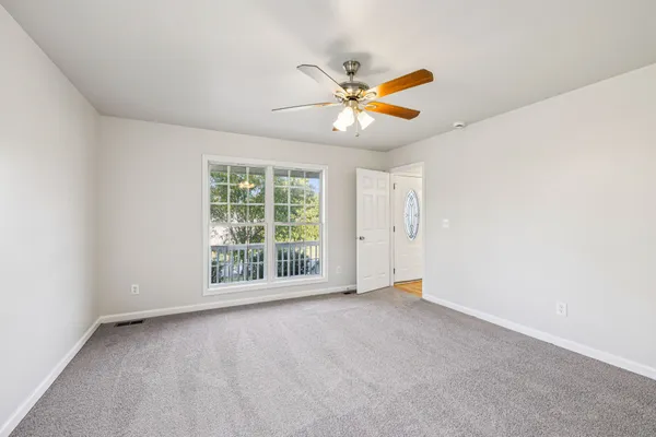a view of an empty room with a window
