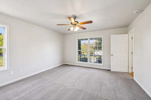 a view of an empty room with a window