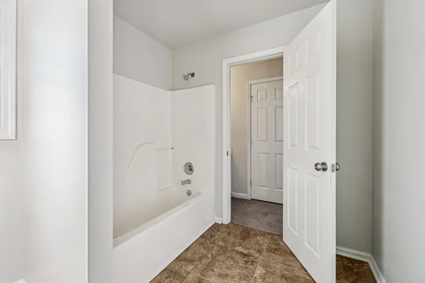a view of a bathroom with a glass door shower