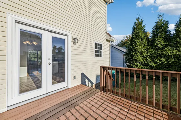 a view of a house with backyard and porch
