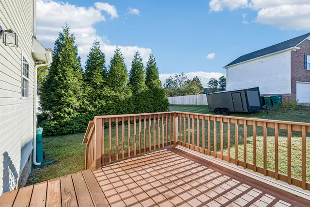 a view of balcony with wooden floor