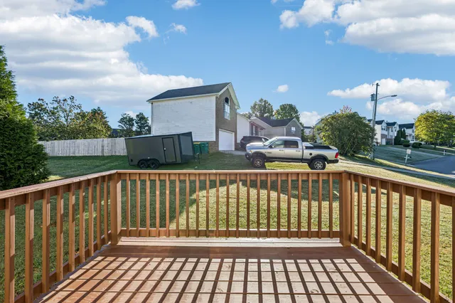 a view of balcony with wooden floor
