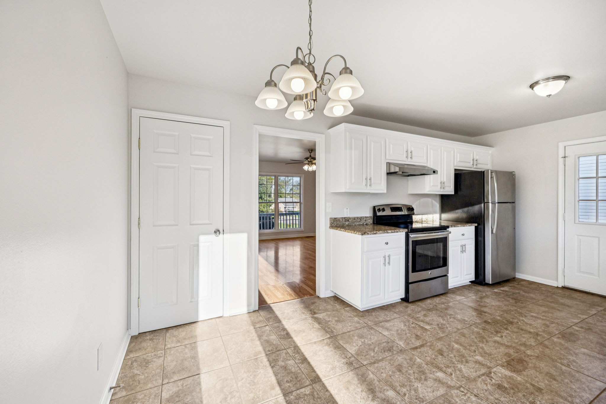 2995 Pipkin Hills Drive Spring Hill, TN 37174 - Photo 10 of 43 a kitchen with stove cabinets and refrigerator
