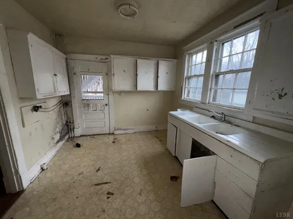 a view of kitchen with furniture and window