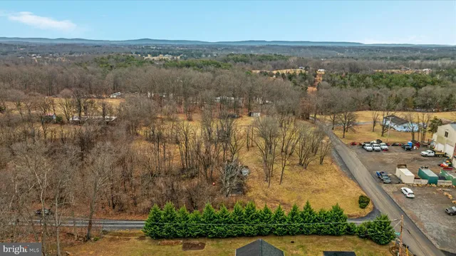 an aerial view of a house with a lake view
