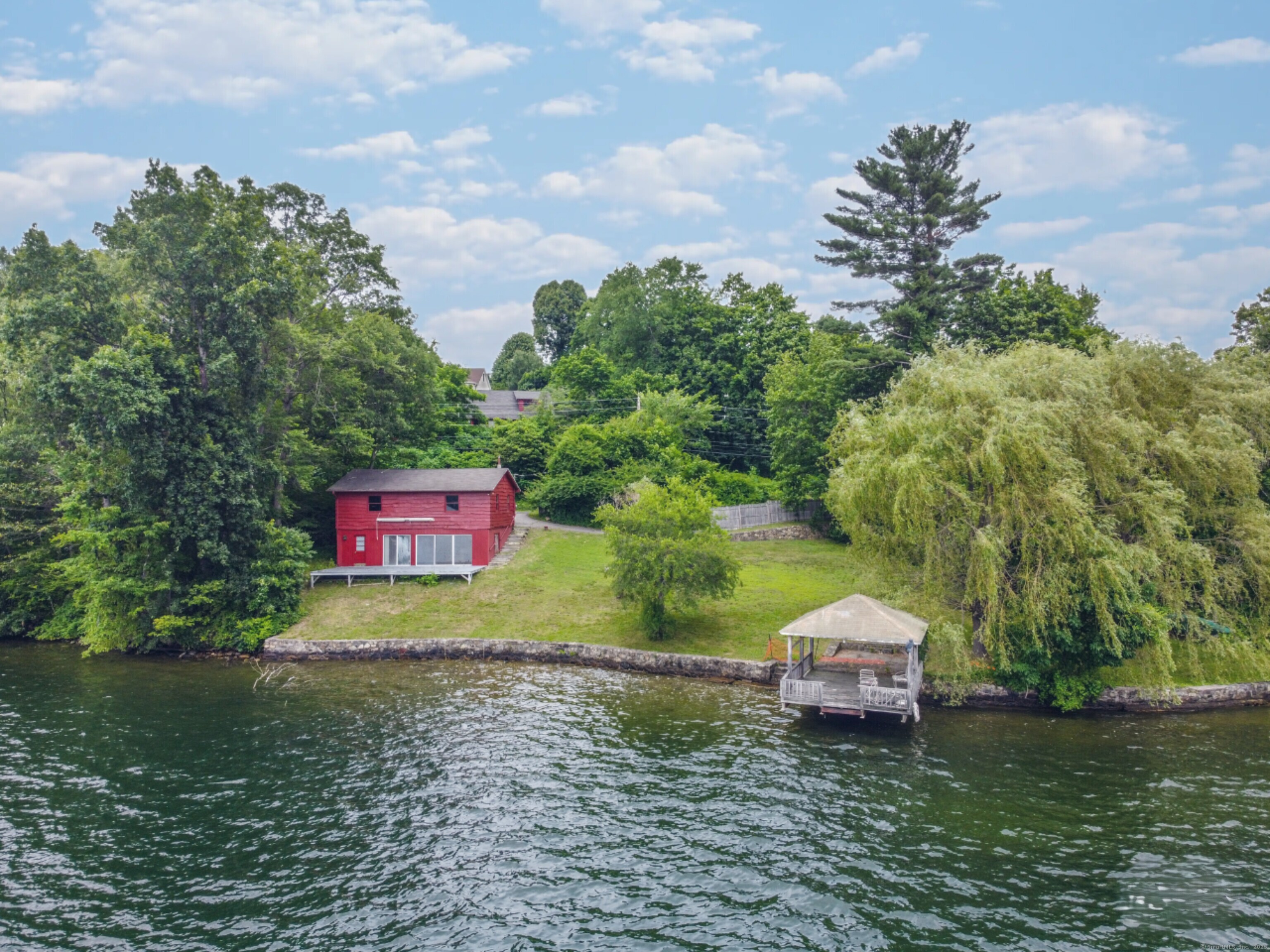 279 Candlewood Lake Road Brookfield, CT 06804 - Photo 1 of 40 a swimming pool with outdoor seating and yard