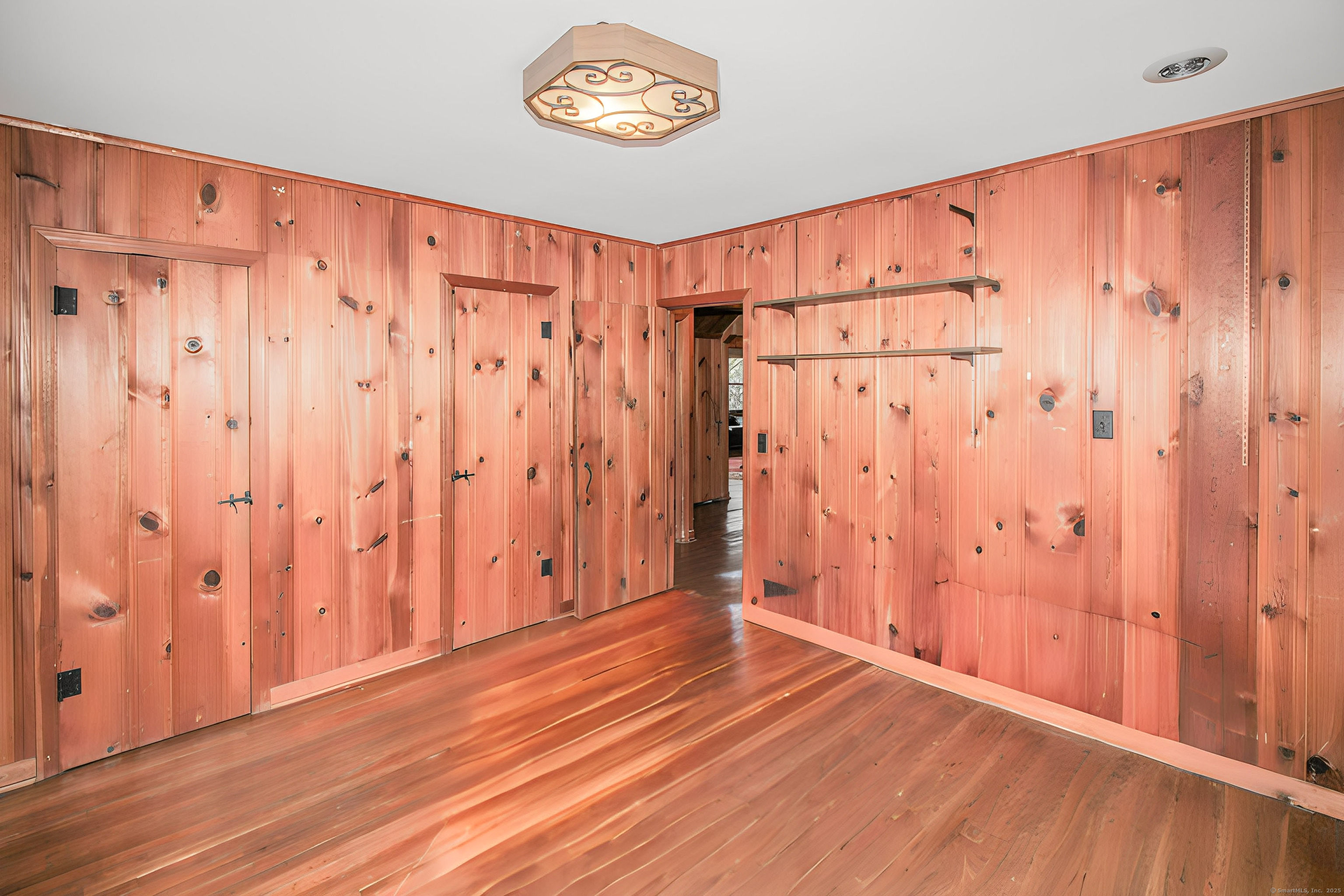 279 Candlewood Lake Road Brookfield, CT 06804 - Photo 18 of 40 a view of a room with wooden walls