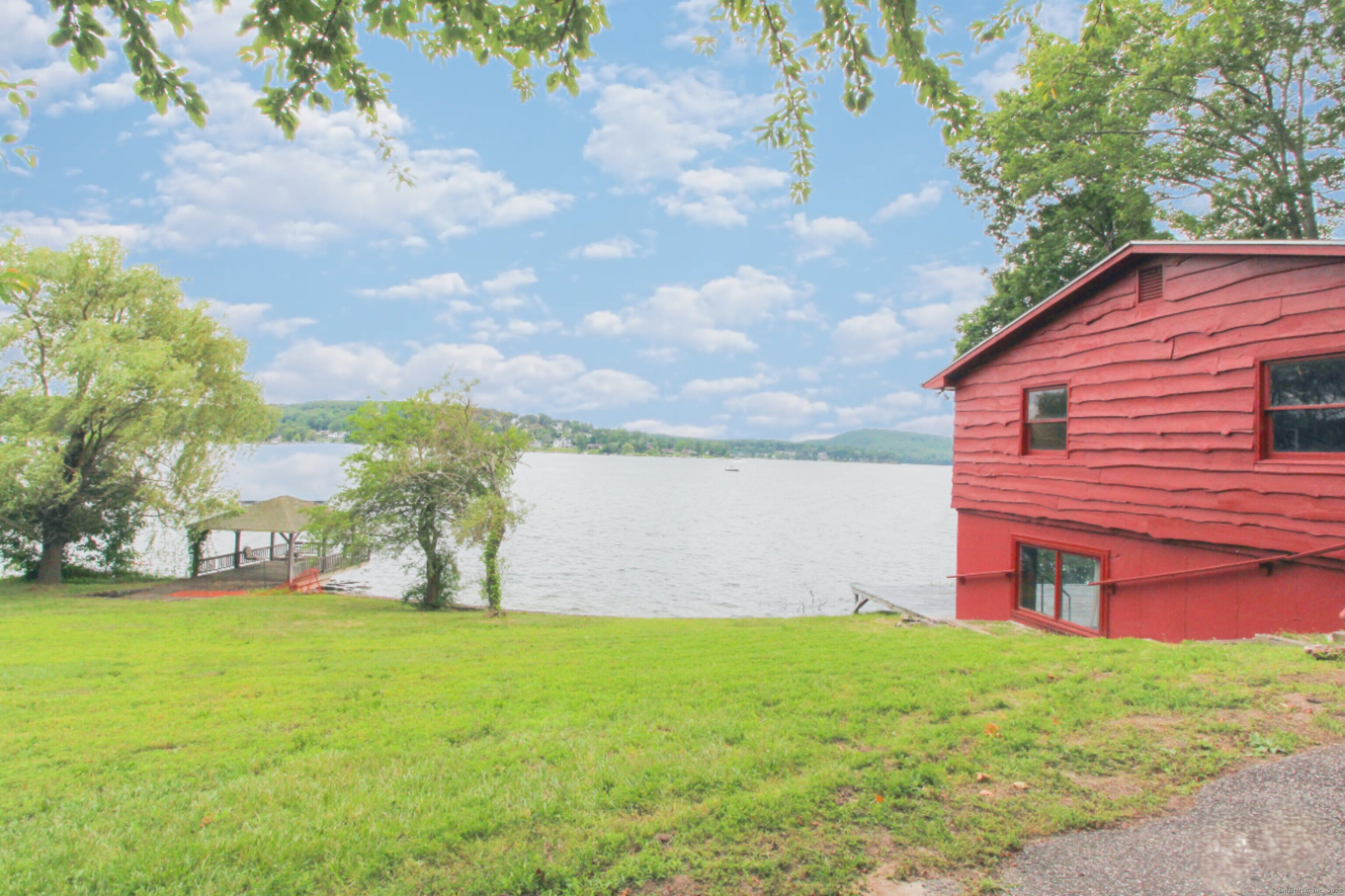 279 Candlewood Lake Road Brookfield, CT 06804 - Photo 22 of 40 a view of a house with a yard