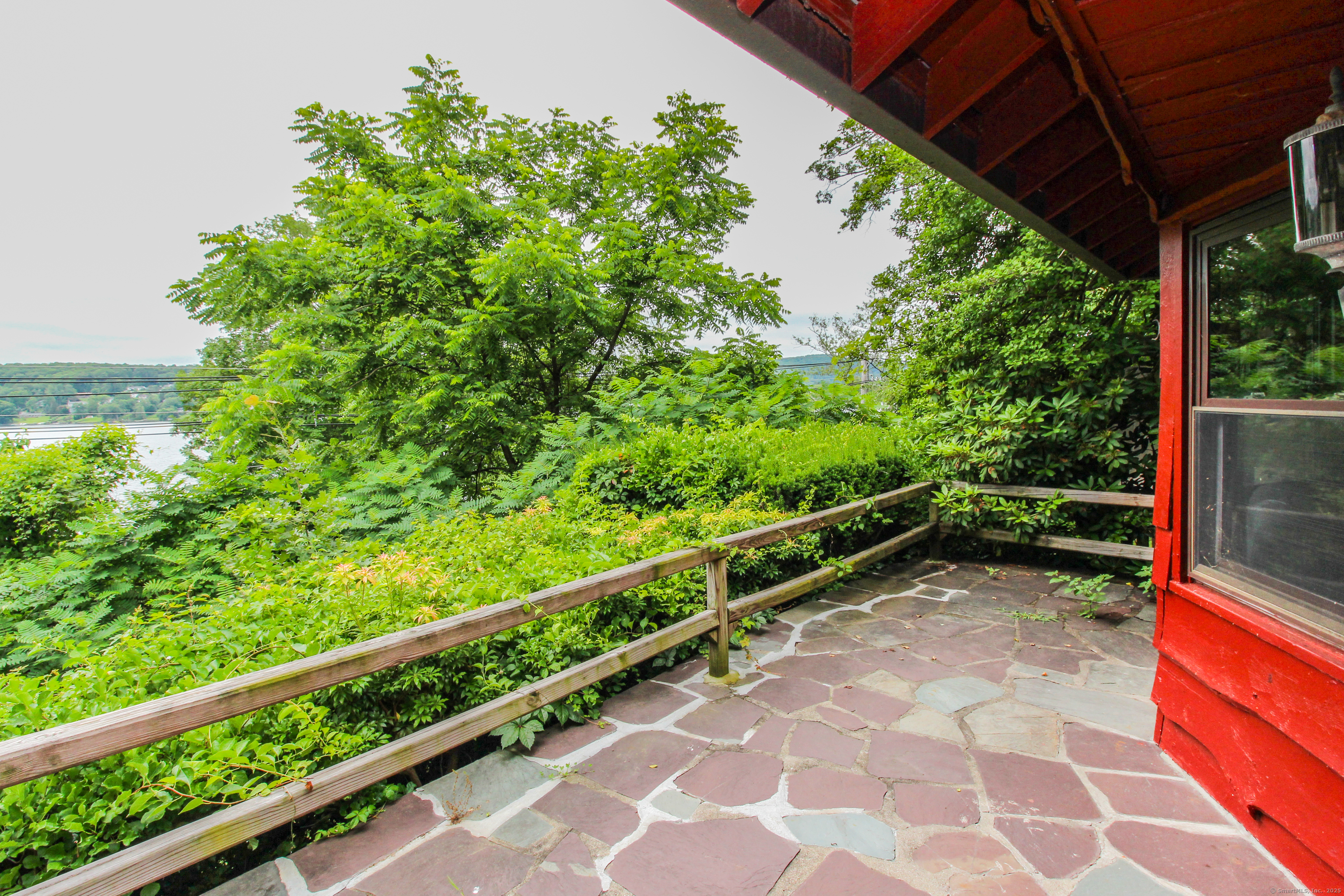 279 Candlewood Lake Road Brookfield, CT 06804 - Photo 4 of 40 a view of a yard with wooden fence