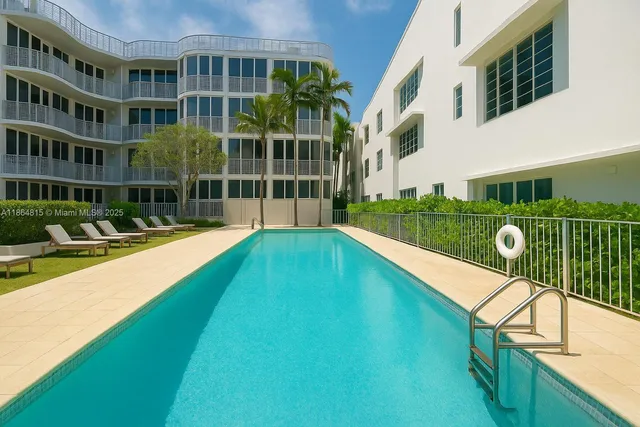a view of swimming pool with outdoor seating and garden