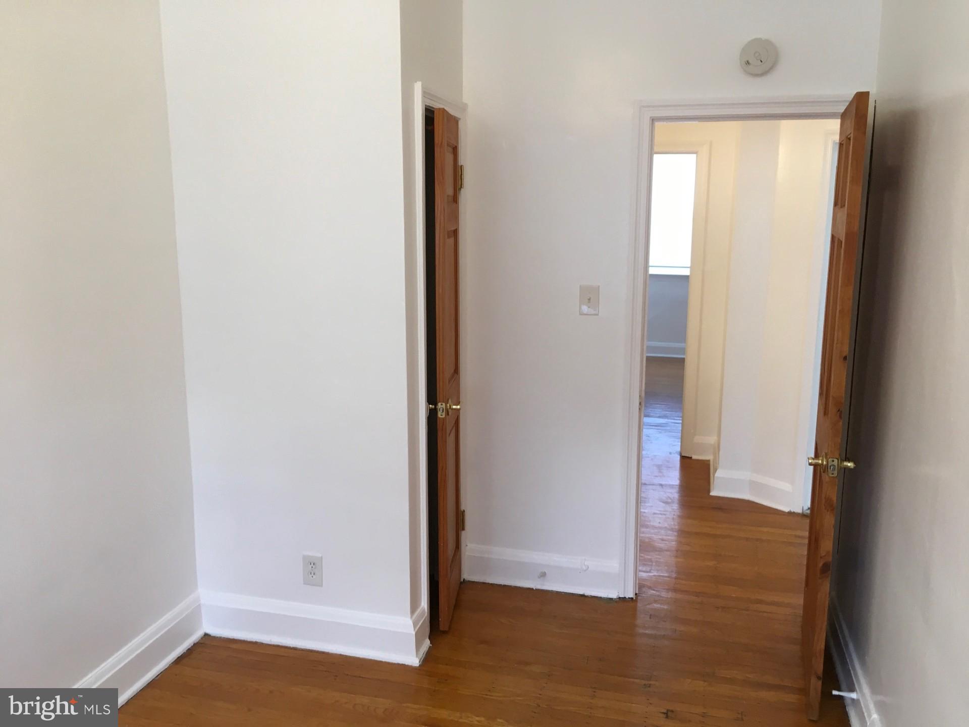 2477 West Cold Spring Lane Baltimore, MD 21215 - Photo 17 of 35 a view of empty room with wooden floor