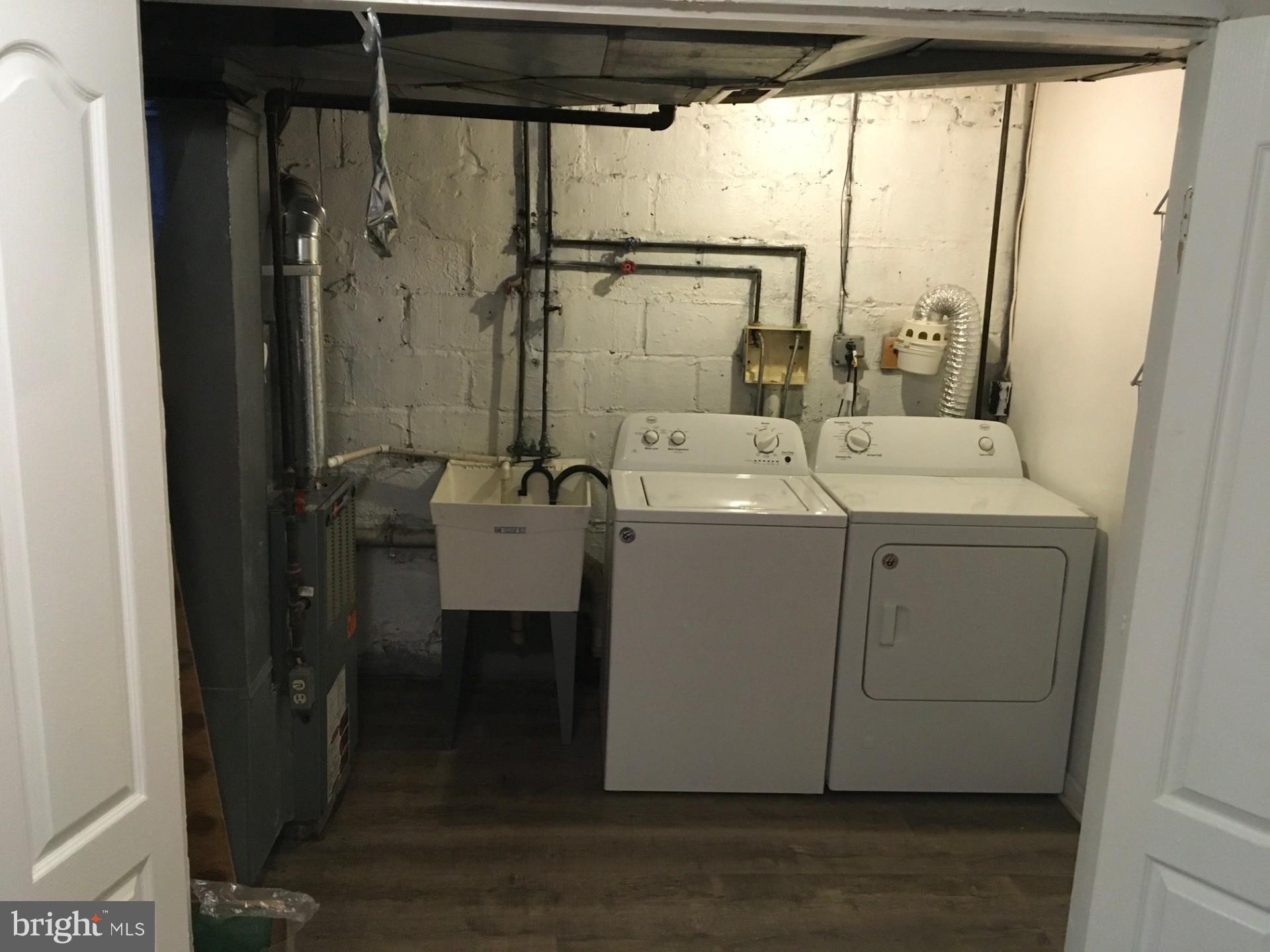 2477 West Cold Spring Lane Baltimore, MD 21215 - Photo 32 of 35 a utility room with dryer and washer