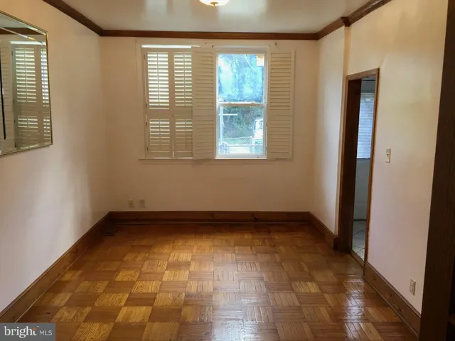 a kitchen with a refrigerator a stove a sink and a window