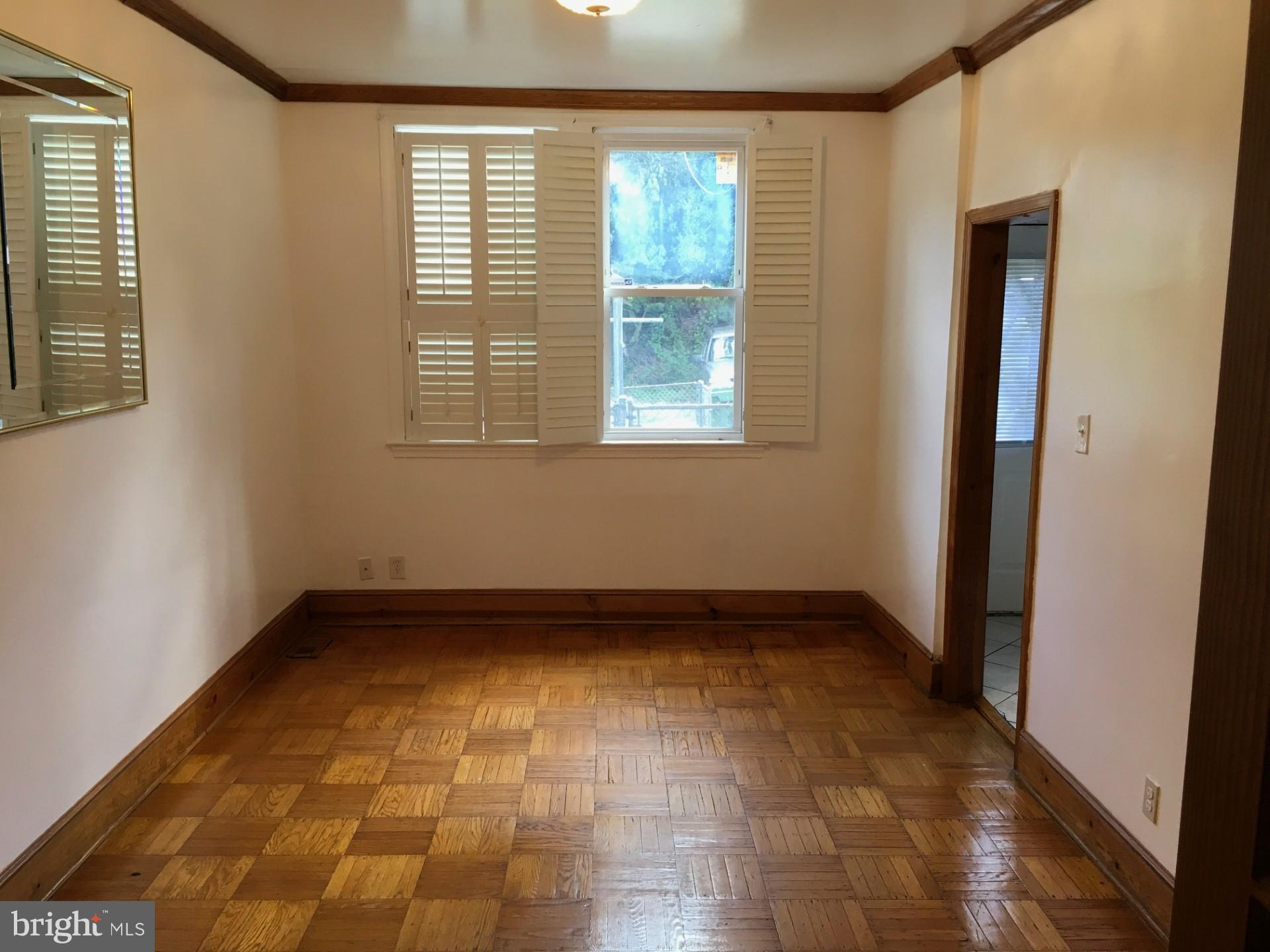 2477 West Cold Spring Lane Baltimore, MD 21215 - Photo 8 of 35 a view of an empty room with a window