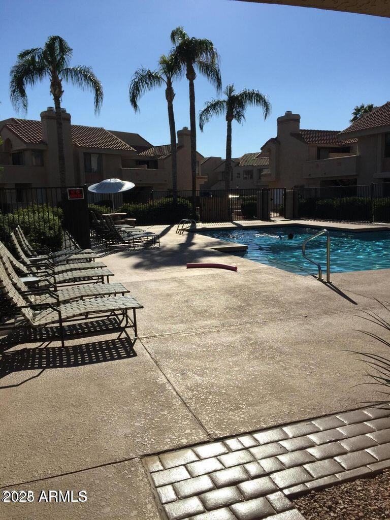 10115 East Mountain View Road, Unit 2036 Scottsdale, AZ 85258 - Photo 6 of 8 a view of a terrace with wooden fence