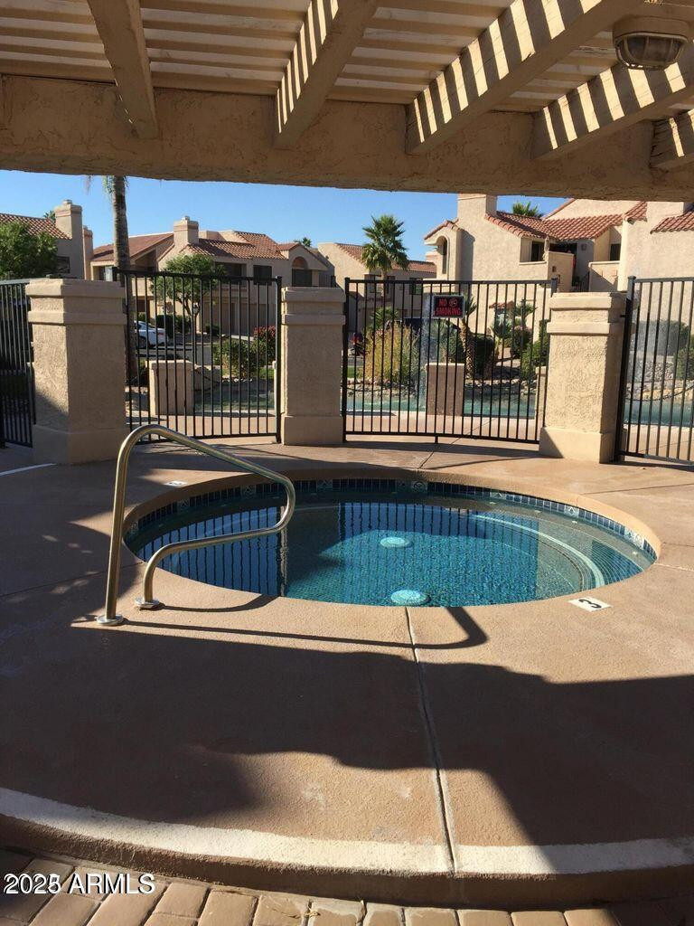 10115 East Mountain View Road, Unit 2036 Scottsdale, AZ 85258 - Photo 7 of 8 a view of swimming pool with outdoor seating