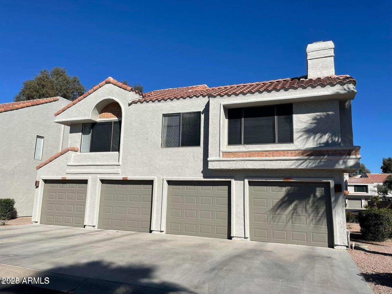 10115 East Mountain View Road, Unit 2036 Scottsdale, AZ 85258 - Photo 8 of 8 a front view of a house with a garage